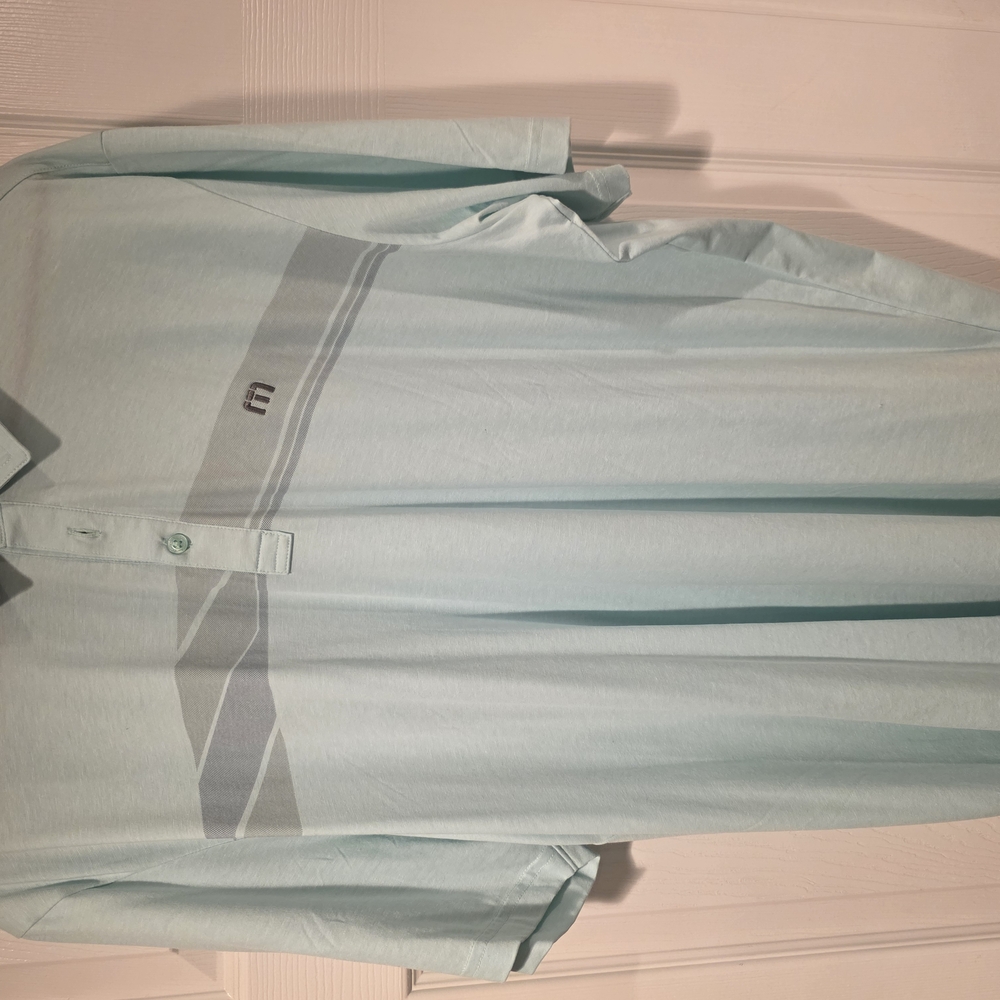 Travis Mathew XXL polo. Color is a light green.